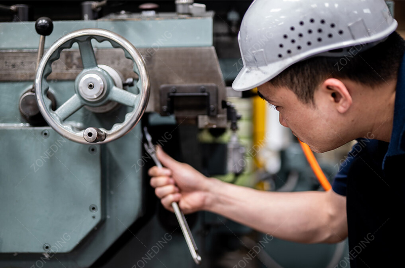 a plant operator inspecting a CIL tank or control room screen